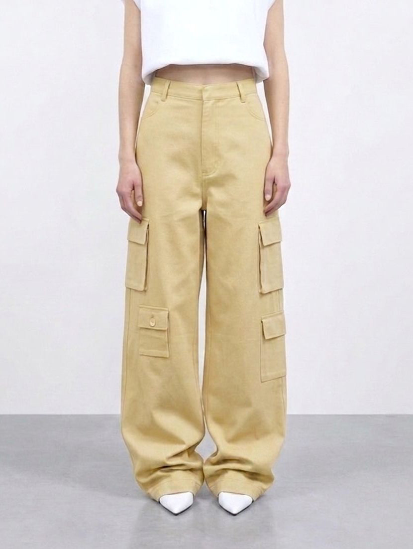Beige cargo pants worn by a person on a white background