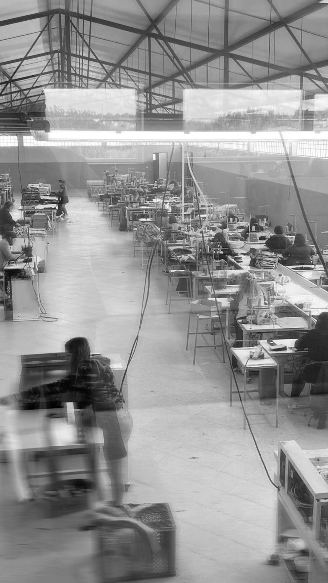 Rhúne production atelier — artisans crafting garments, reflecting precision and sustainable craftsmanship