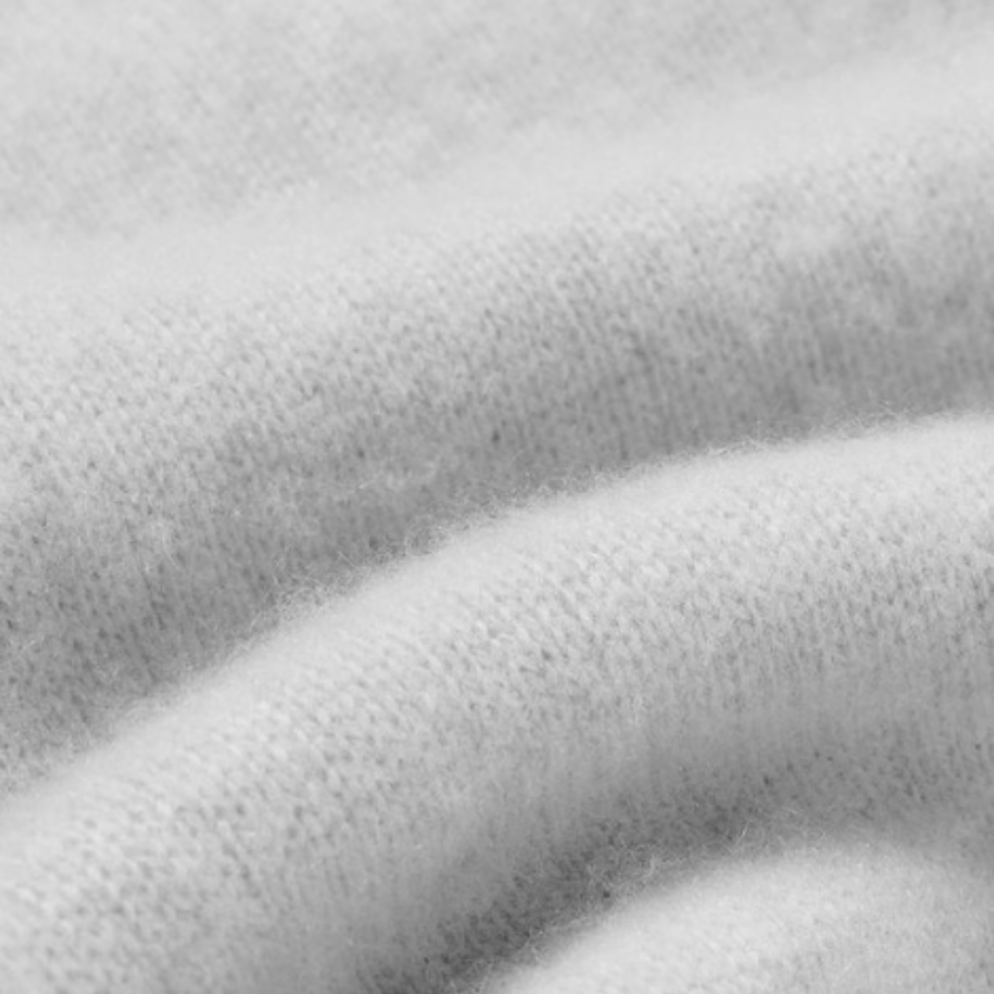 Close-up of Rhúne’s luxurious cashmere texture — soft, enduring, and understated