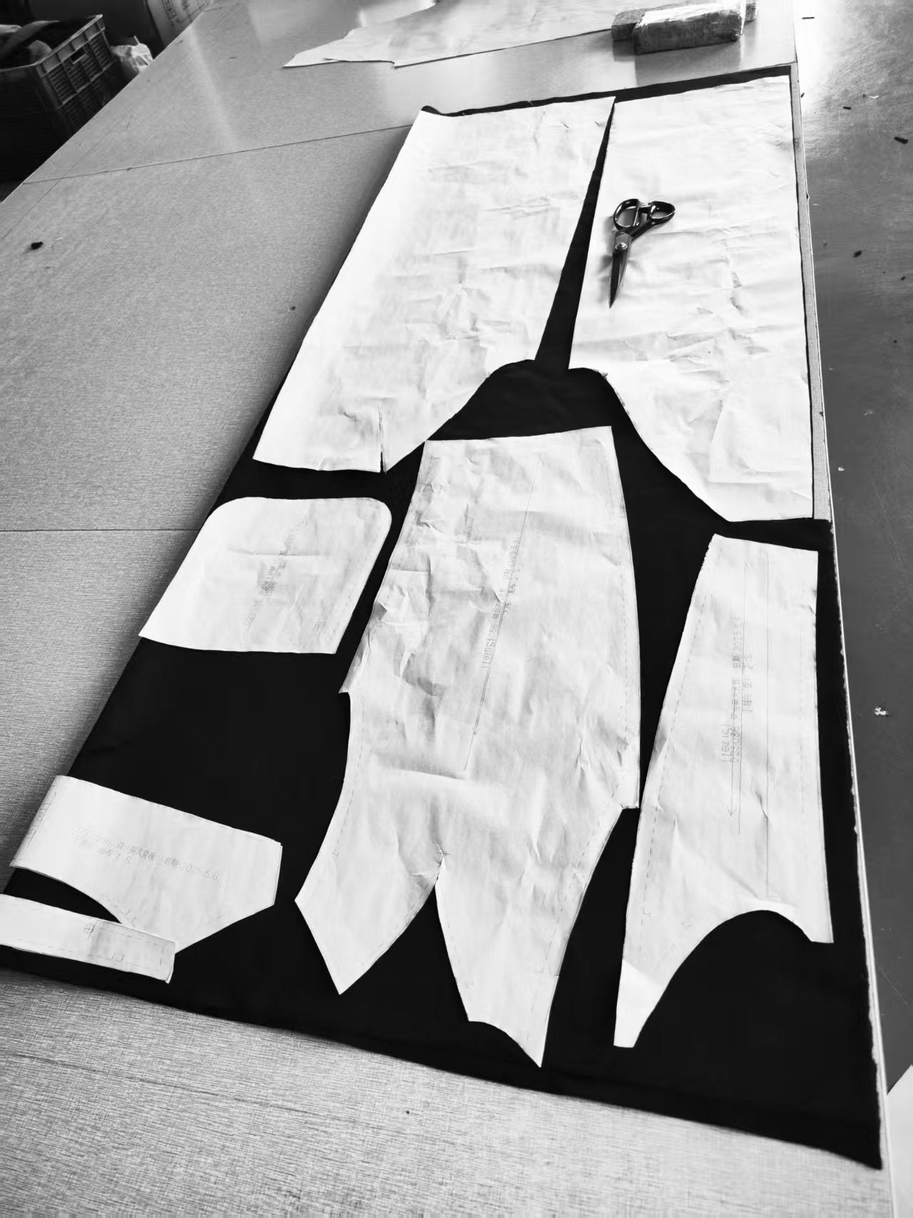 Tailoring pattern layout at Rhúne atelier — precise craftsmanship and attention to design detail