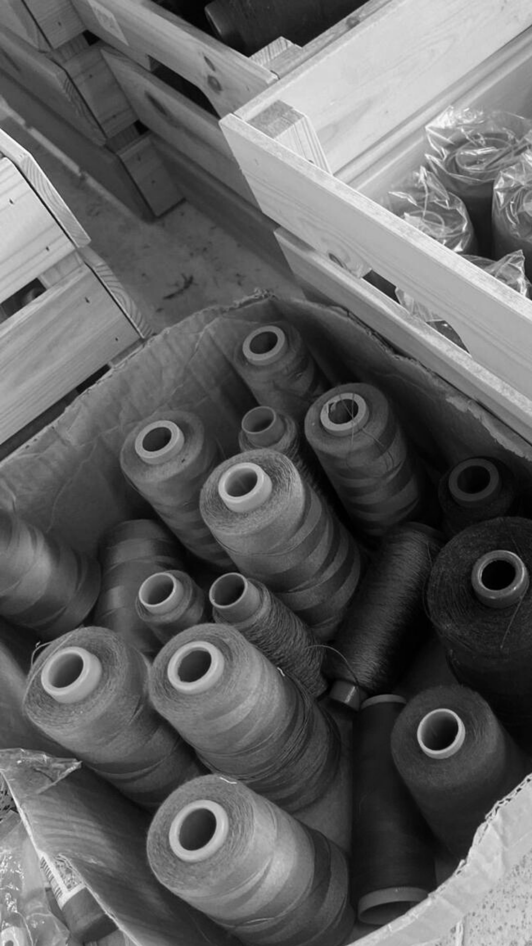 Spools of natural yarns in Rhúne’s atelier — high-quality fibres used for luxury knitwear and tailoring
