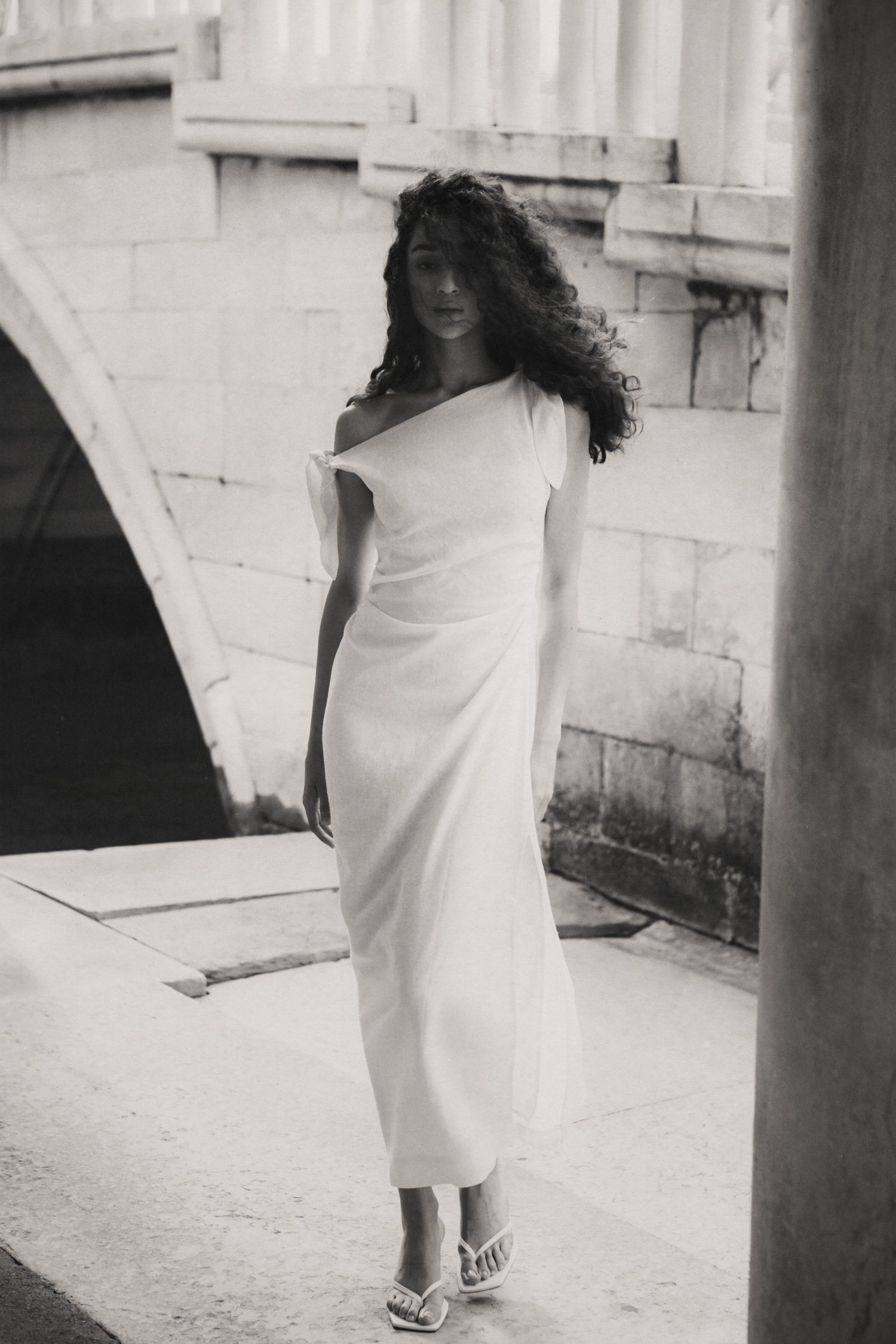 Rhúne SS24 Elena Dress — timeless one-shoulder silhouette in soft monochrome tones